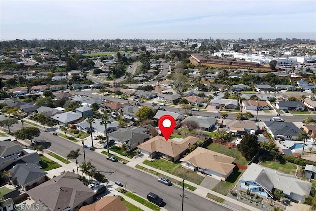 birds eye view of property with a residential view