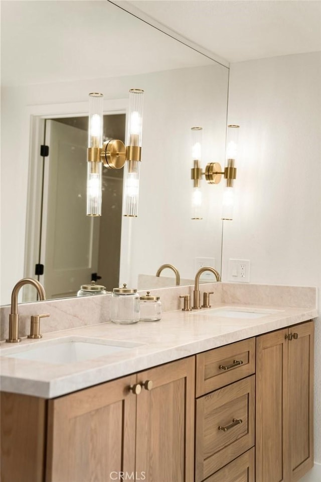 full bath with double vanity and a sink