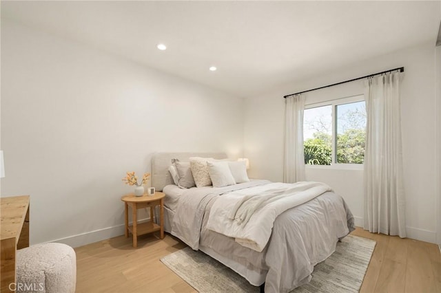 bedroom featuring recessed lighting, baseboards, and light wood finished floors