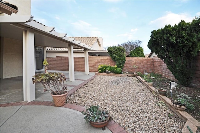 view of yard featuring a fenced backyard and a patio