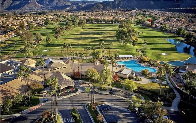 aerial view with a mountain view, a residential view, and view of golf course