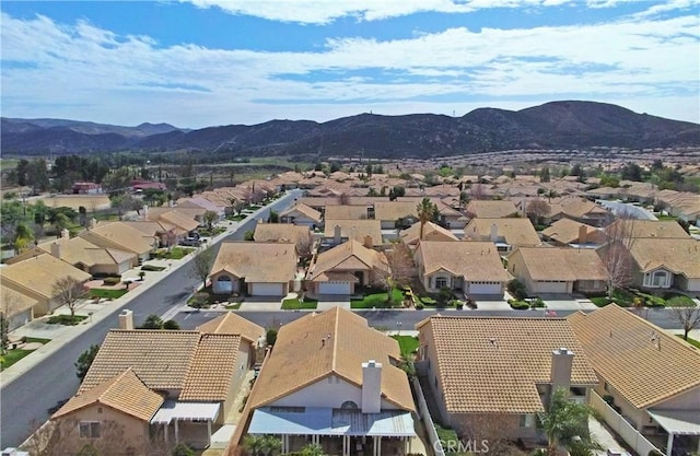 drone / aerial view featuring a mountain view and a residential view