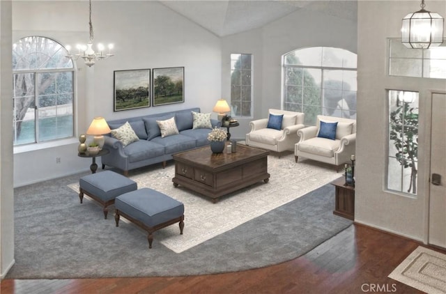 living area with a notable chandelier, wood finished floors, and high vaulted ceiling