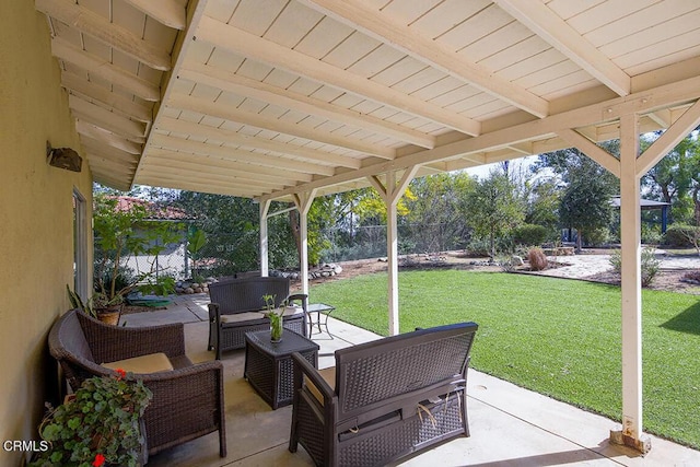 view of patio / terrace with an outdoor hangout area and fence