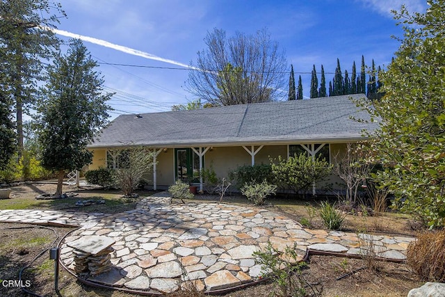 ranch-style house with stucco siding