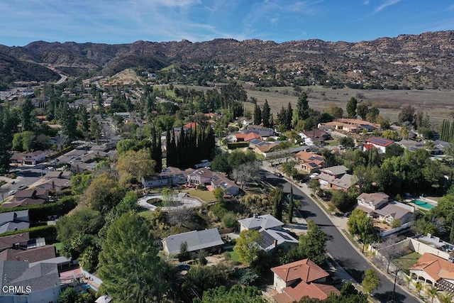 drone / aerial view with a residential view and a mountain view