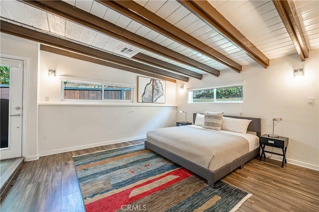 bedroom featuring baseboards, visible vents, wooden ceiling, wood finished floors, and beam ceiling