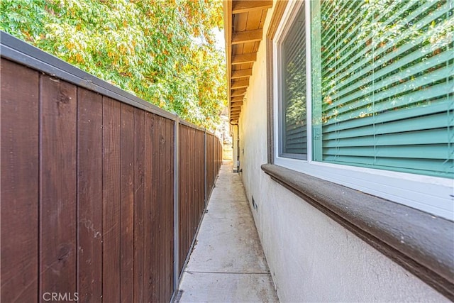 view of side of property featuring fence