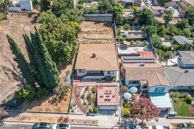 birds eye view of property with a residential view