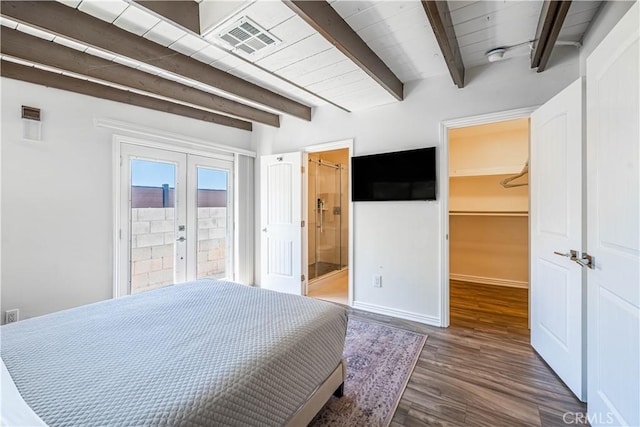 bedroom featuring visible vents, wood finished floors, a spacious closet, french doors, and beam ceiling