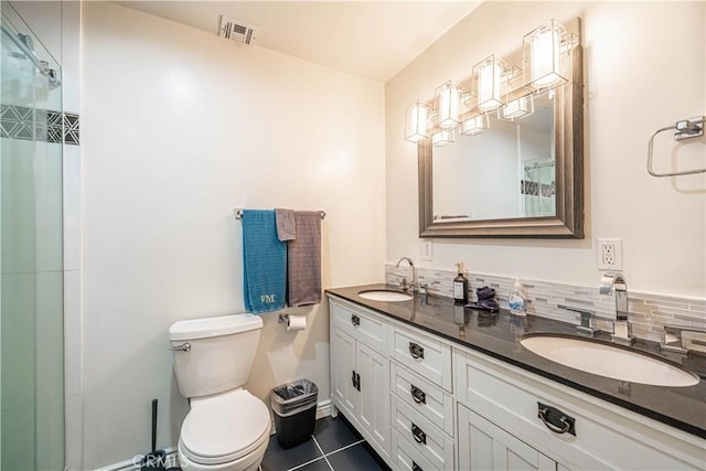 full bath with tasteful backsplash, visible vents, a sink, and toilet