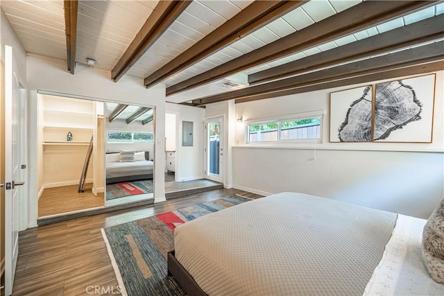 bedroom with wood ceiling, wood finished floors, beam ceiling, and baseboards