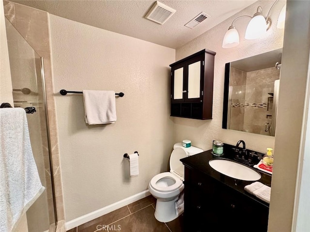 bathroom featuring tile patterned flooring, visible vents, and a shower stall