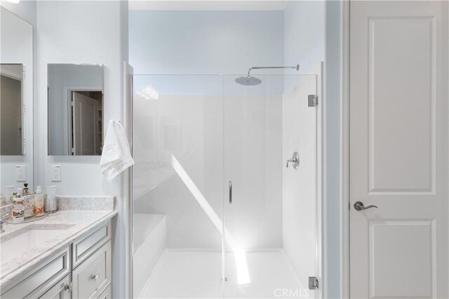 24674 Crestley Dr, Corona, CA 92883 - bathroom featuring vanity and a shower with shower door