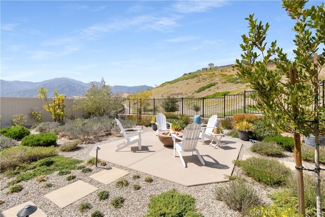 24674 Crestley Dr, Corona, CA 92883 - fenced backyard featuring a patio area, a fire pit, and a mountain view
