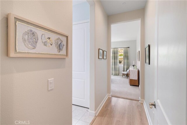 24674 Crestley Dr, Corona, CA 92883 - hall with baseboards and light wood-type flooring