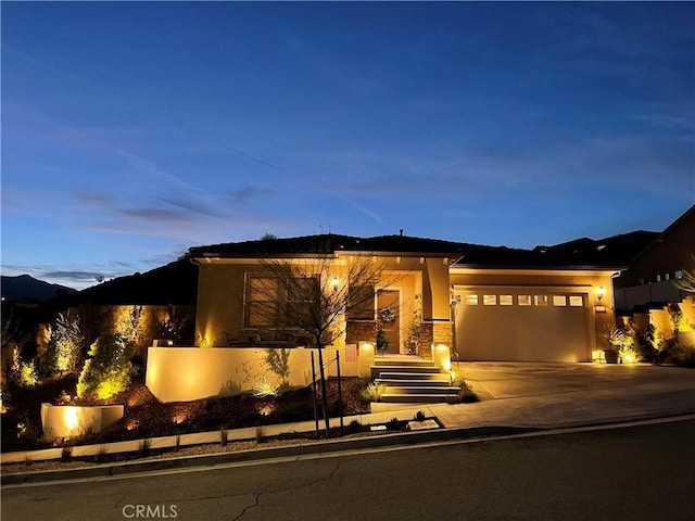 24674 Crestley Dr, Corona, CA 92883 - view of front of property featuring concrete driveway, an attached garage, and stucco siding