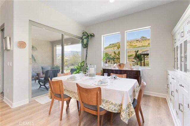 24674 Crestley Dr, Corona, CA 92883 - dining room with light wood-style floors and baseboards