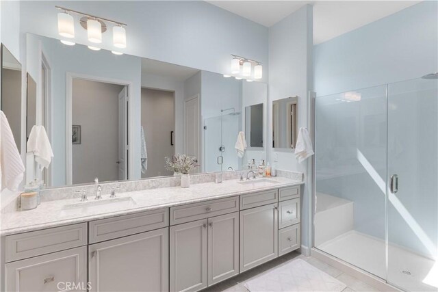 24674 Crestley Dr, Corona, CA 92883 - bathroom featuring double vanity and a shower stall