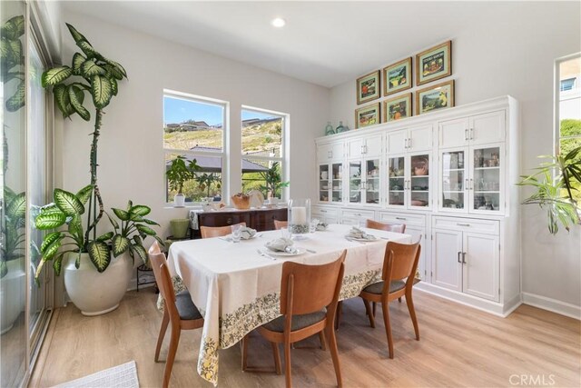 24674 Crestley Dr, Corona, CA 92883 - dining space featuring light wood-type flooring, baseboards, and recessed lighting