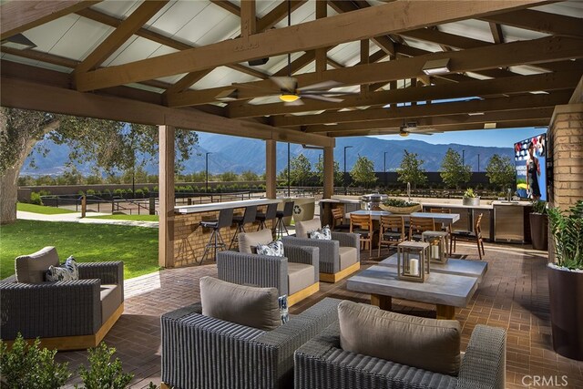 24674 Crestley Dr, Corona, CA 92883 - view of patio featuring a mountain view, a gazebo, ceiling fan, and an outdoor hangout area