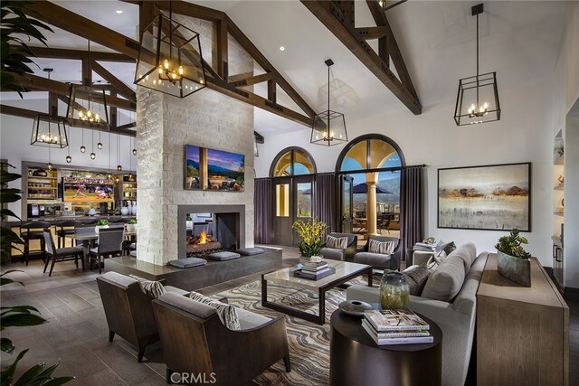 24674 Crestley Dr, Corona, CA 92883 - living area featuring high vaulted ceiling, a chandelier, beam ceiling, and a multi sided fireplace