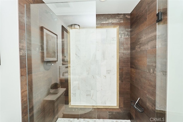 full bathroom with tiled shower