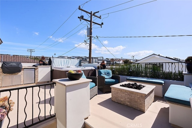 view of patio with an outdoor living space with a fire pit and an outdoor kitchen