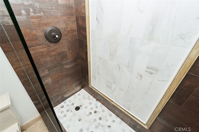 bathroom with a shower stall