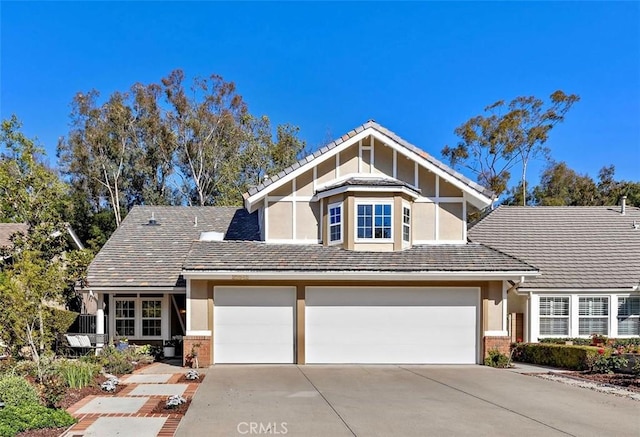 view of front of home with concrete driveway and brick siding