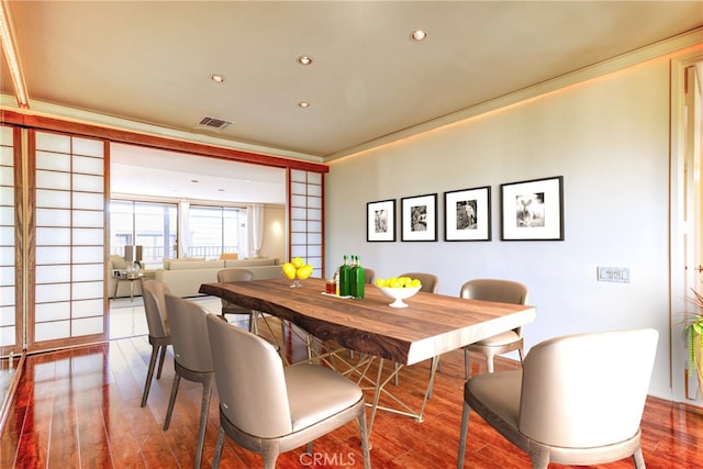 dining room with recessed lighting, visible vents, crown molding, and hardwood / wood-style flooring