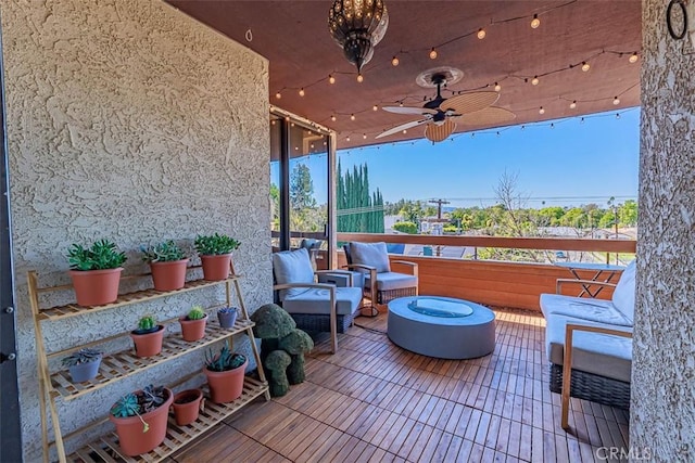 view of patio featuring a ceiling fan and an outdoor hangout area