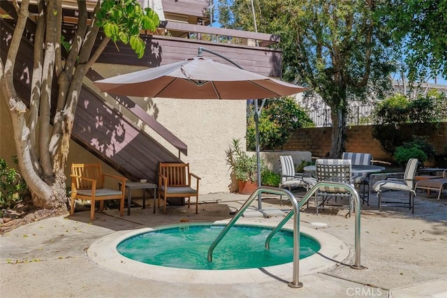 view of swimming pool with a patio area, outdoor dining space, and fence