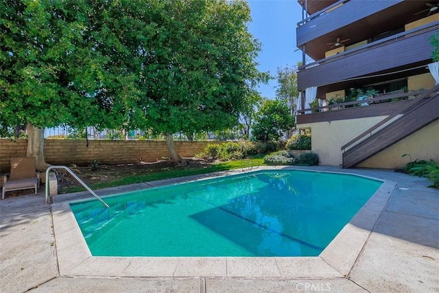 view of pool with a fenced in pool, a patio, and fence