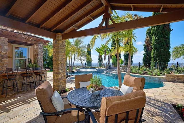 view of patio featuring a gazebo, outdoor dining space, an outdoor pool, and fence