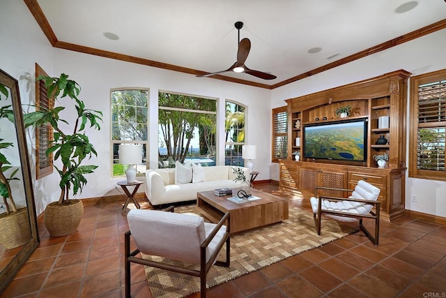 living area with visible vents, dark tile patterned floors, a ceiling fan, crown molding, and baseboards