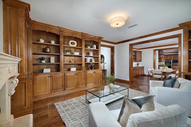 living area featuring dark wood-style floors, visible vents, crown molding, and baseboards