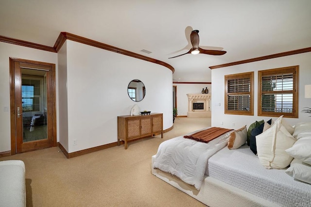 bedroom featuring visible vents, a fireplace with raised hearth, ornamental molding, baseboards, and light colored carpet