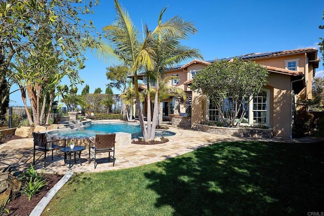 pool featuring a patio and a yard