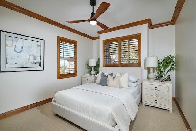 bedroom with ceiling fan, baseboards, light carpet, and ornamental molding