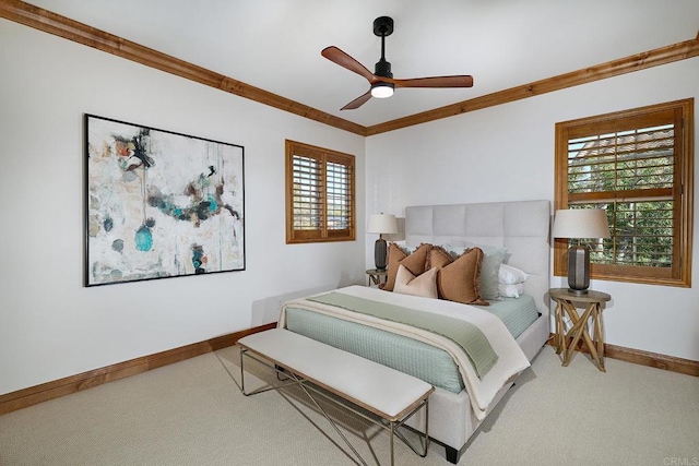 bedroom featuring crown molding, carpet flooring, a ceiling fan, and baseboards