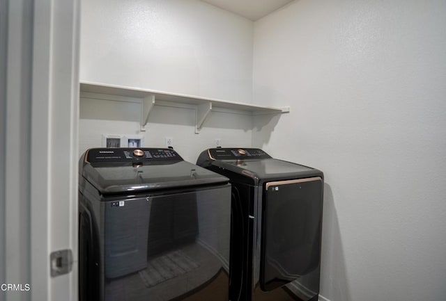 laundry room featuring laundry area and separate washer and dryer