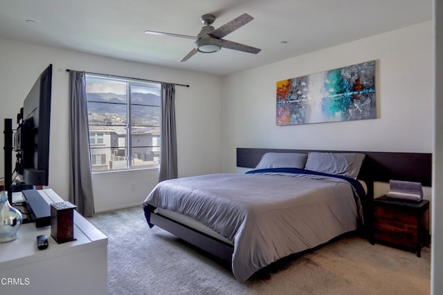 bedroom featuring carpet floors, ceiling fan, and baseboards