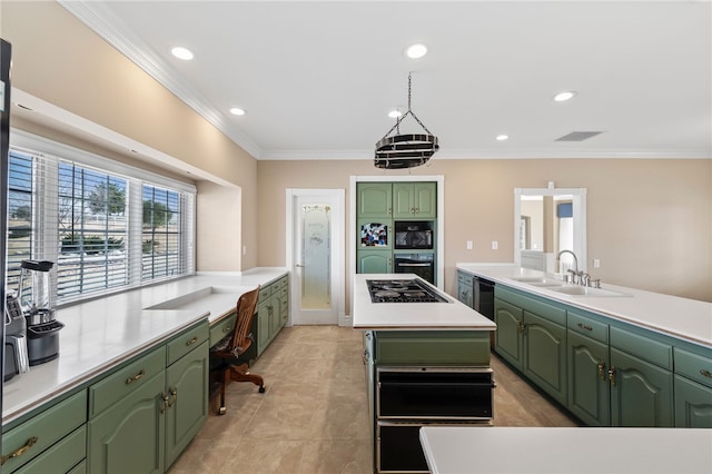 kitchen with built in study area, a kitchen island, a sink, and green cabinets