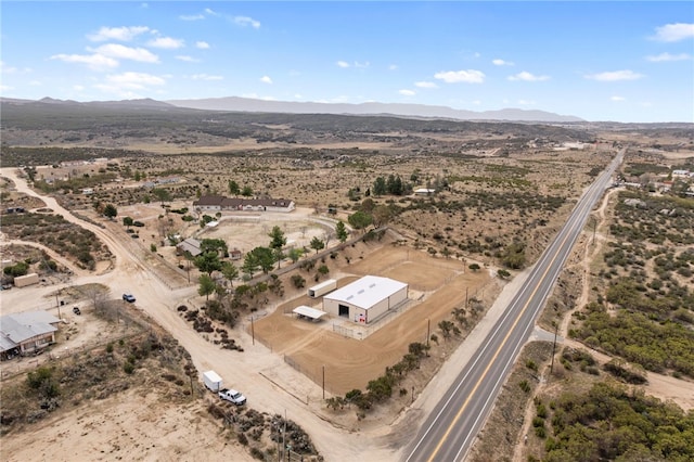 aerial view featuring view of desert, a rural view, and a mountain view