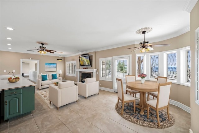 dining area featuring recessed lighting, a fireplace, baseboards, and ceiling fan