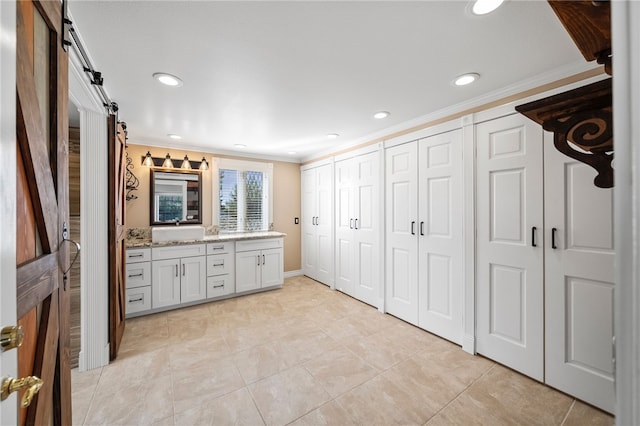 bathroom featuring ornamental molding, recessed lighting, vanity, and tile patterned floors