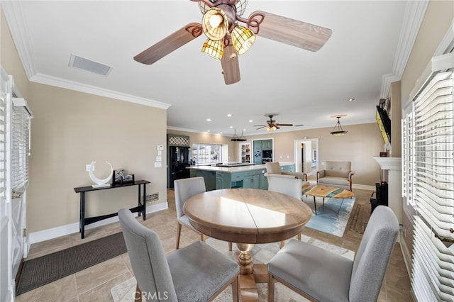 39725 Ivan Dr, Anza, CA 92539 - dining area featuring a ceiling fan, a fireplace, light tile patterned flooring, baseboards, and ornamental molding