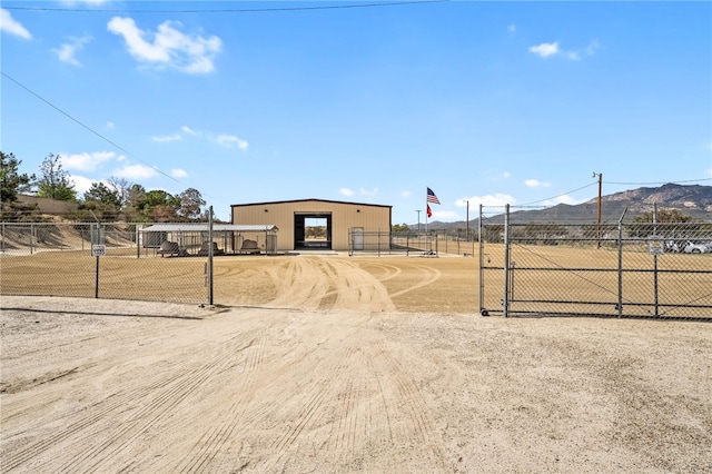 exterior space featuring fence and a mountain view