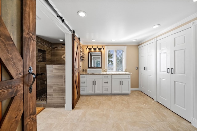 full bathroom featuring recessed lighting, vanity, baseboards, ornamental molding, and walk in shower